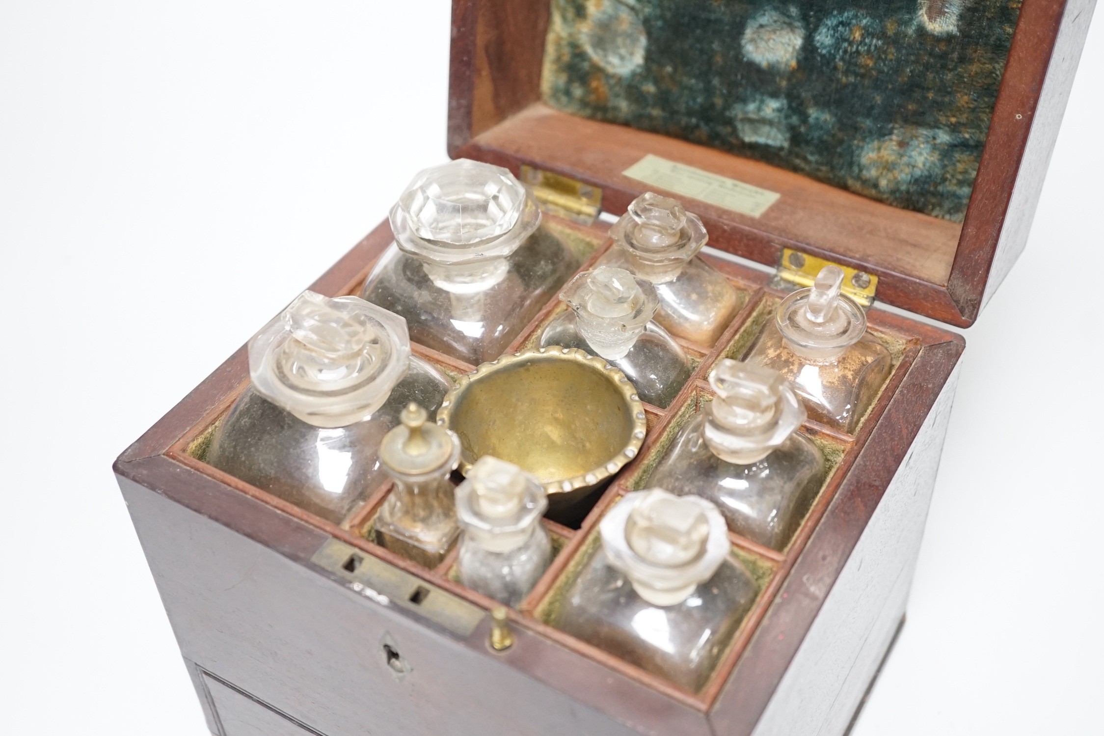 A George III mahogany cased travelling apothecary set with glass flasks, 19cm high